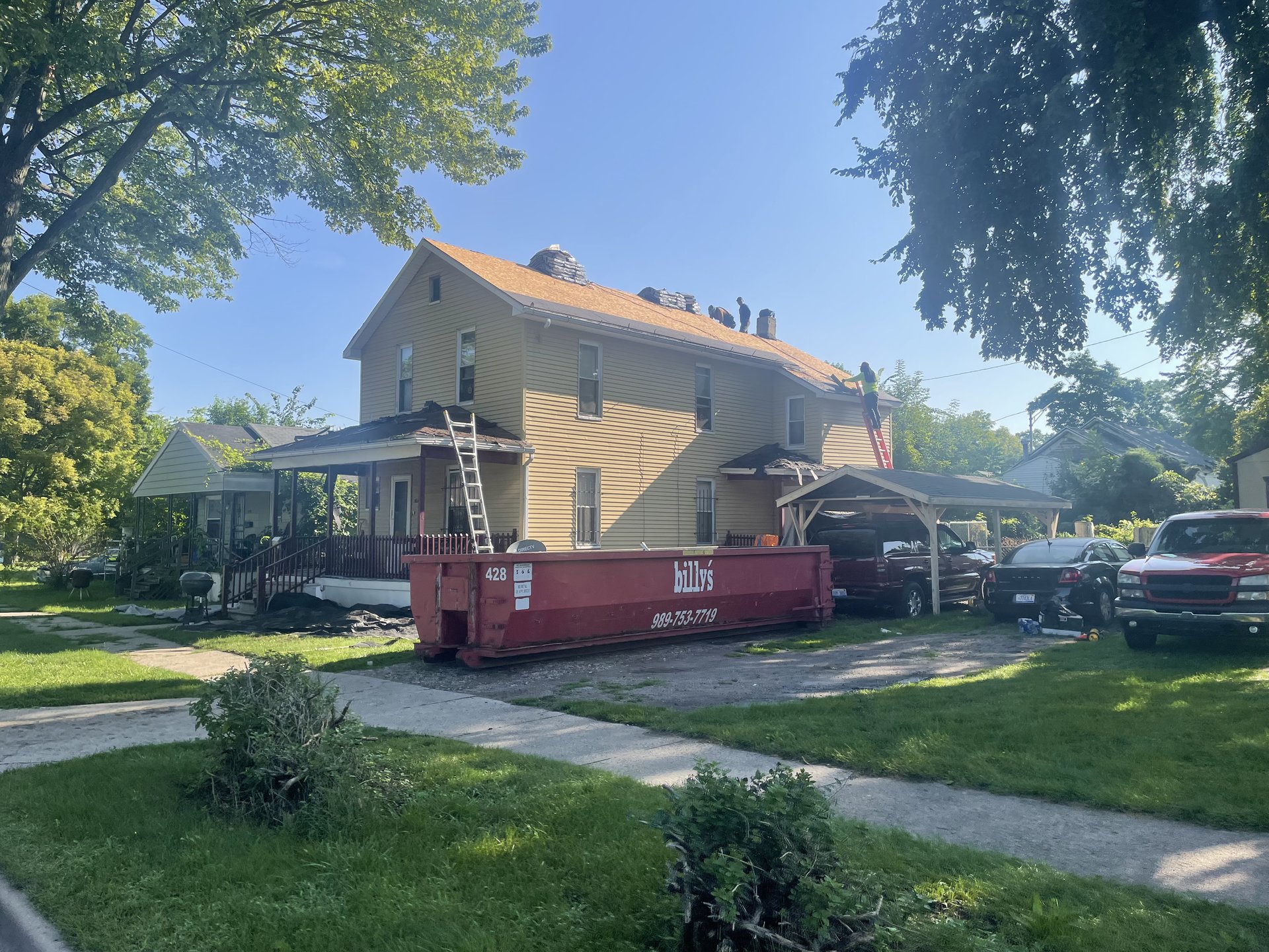 Roof replacement with chimney flashing on a Michigan home