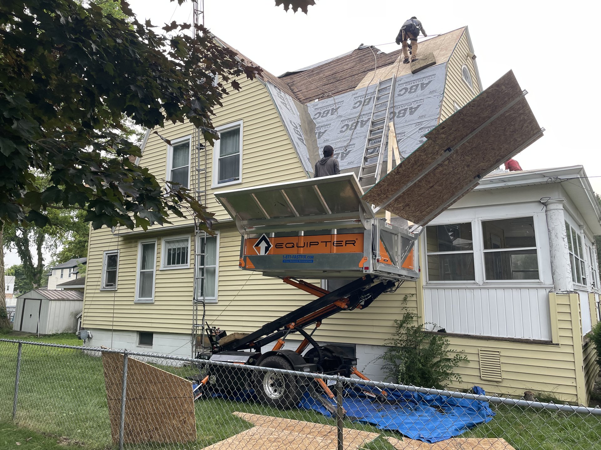 FastFix Roofing crew working on a Michigan roof replacement